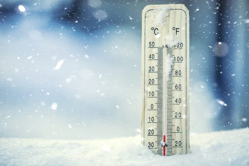 Thermometer on snow shows low temperatures under zero. Low temperatures in degrees Celsius and fahrenheit. Cold winter weather twenty under zero. cold weather paint