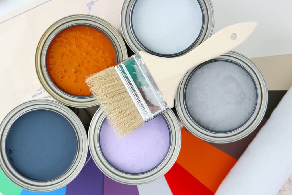 Paint cans ready to be used on white background