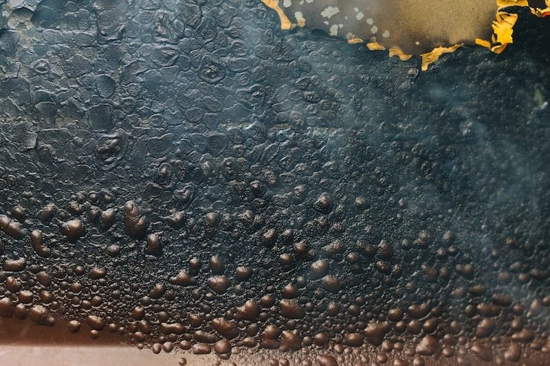burning blister paint on metal surface background