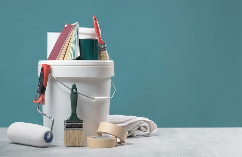 color swatches, painting roller and paint brushes