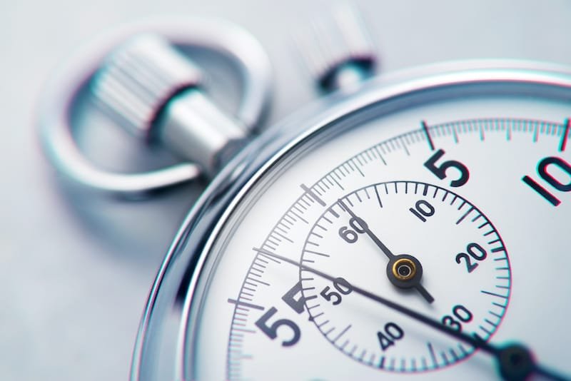 Classic metallic chrome mechanical analog stopwatch. Close up shot.