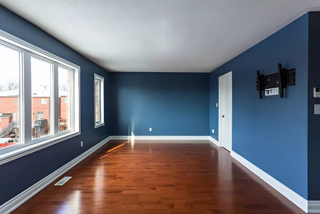Freshly painted living room with smooth blue walls and clean edges completed by house painters in Boise, ID