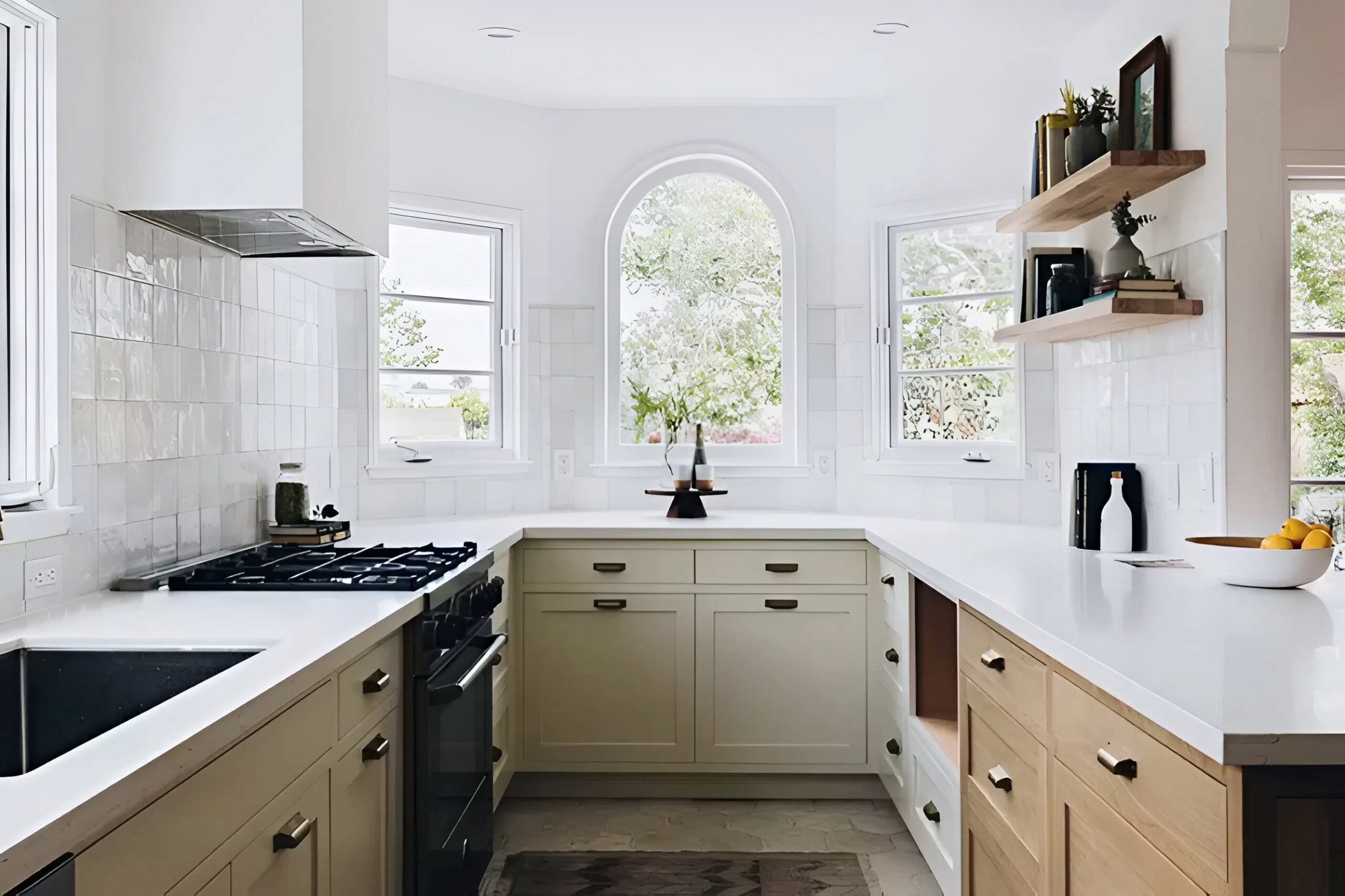 Freshly painted soft beige kitchen cabinets with smooth satin finish and white walls by a painter in Cascade, ID