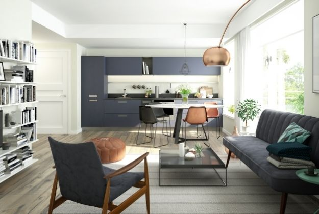 Modern living room and kitchen with cohesive neutral and blue tones by a house painter in Middleton, ID