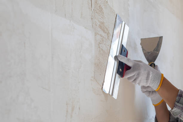 Professional drywall surface repair and wall preparation before applying a smooth, durable paint finish by a house painter in Boise, ID.