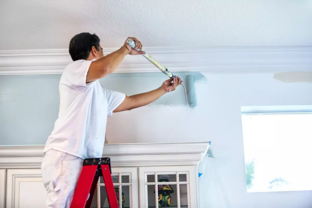 Light gray interior wall painting with crisp white trim and crown molding by a house painter in Boise, ID 